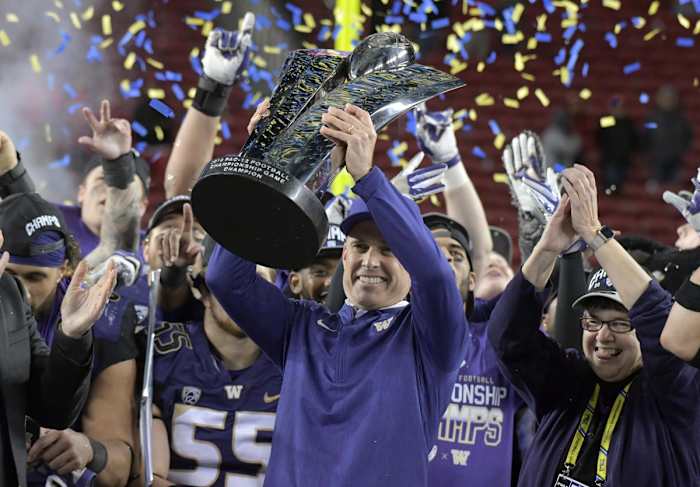 Nov 30, 2018; Santa Clara, CA, USA; Washington Huskies head coach Chris Petersen hoists the championship trophy after the 2018 Pac-12 Championship against the Utah Utes at Levi's Stadium. Washington defeated Utah 10-3. Mandatory Credit: Kirby Lee-USA TODAY Sports
